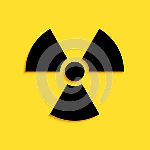 Black Radioactive icon isolated on yellow background. Radioactive toxic symbol. Radiation Hazard sign. Long shadow style