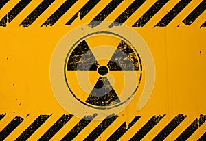 Black radioactive sign over yellow background