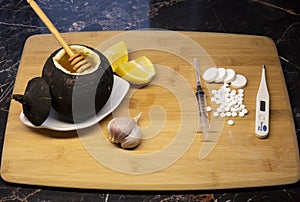 Black radish with honey or cold pills . Opting for natural honey cough syrup . photo