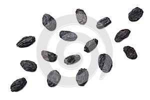 black raisins isolated on white background. top view