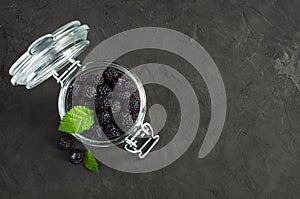 Black raspberry or blackberry in glass jar