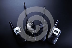 Black rectangle portable device with antenna isolated on black background. radio transceiver set for communication
