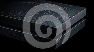 A black rectangular object with a textured surface.