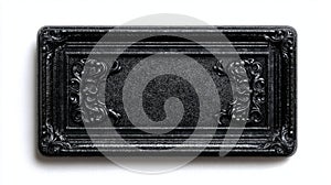 A black rectangular object with a textured surface