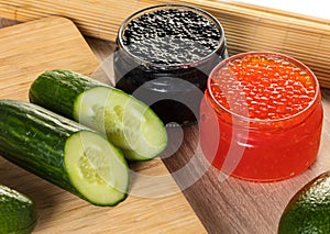 Black and red caviar in a jar