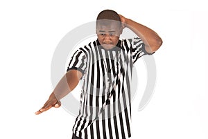 Black referee calling an offensive foul photo