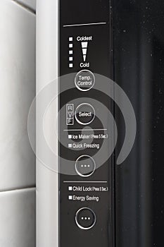 A black refrigerator fridge front control panel details