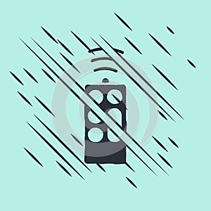 Black Remote control icon isolated on green background. Glitch style. Vector