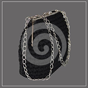 Black reticule bag with silver clasp and chain. Classic bag, vintage style. Fashion. Vector isolated photo