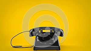 Black retro styled telephone on yellow background