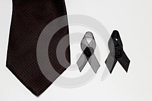 Black ribbon and black necktie; decoration black ribbon hand made artistic design for sadness expression isolated on white