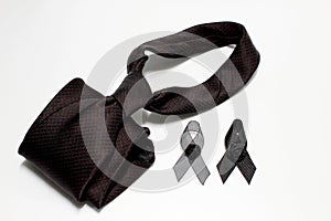 Black ribbon and black necktie; decoration black ribbon hand made artistic design for sadness expression isolated on white