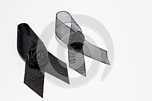 Black ribbon; decoration black ribbon hand made artistic design for sadness expression isolated on white background.