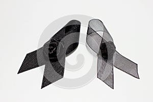 Black ribbon; decoration black ribbon hand made artistic design for sadness expression isolated on white background.