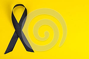 Black ribbon is symbol of fight against melanoma and skin cancer photo