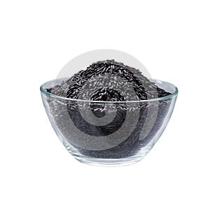 Black rice in a clear glass bowl isolated on white background.black rice heap in glass bowl