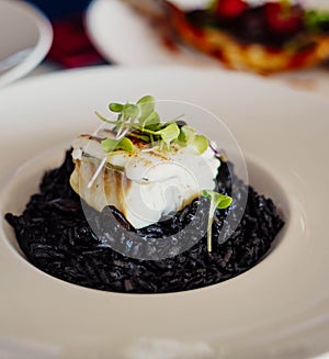Black rice with cuttlefish and squid ink photo