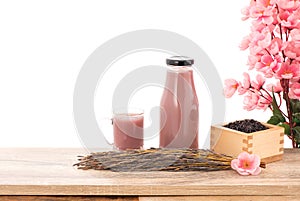 Black Rice or Oryza sativa are fermented to make Amazake, sake or rice wine isolated on white background