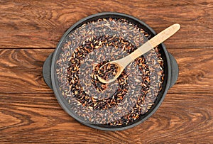 Black rice in pan