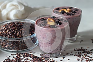 Black rice pudding. Made with black rice simmered in milk, sweetened with sugar and flavoured with cardamom. Black rice is called