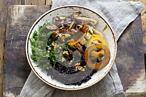 Black rice with roasted delicata squash, massaged kale and shiitake mushrooms