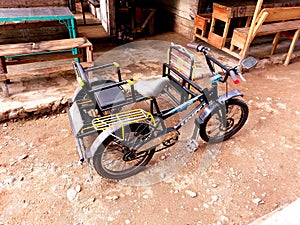 black rickshaw side view