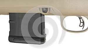 Black rifle magazine inserted just in front of the trigger