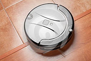 Black robotic vacuum cleaner, modern smart appliance, perfect automated floor cleaning tool to help automate housekeeping