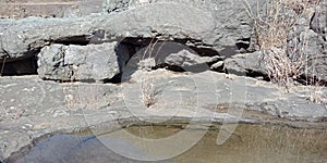 Black rock with river water or mountains,nature landscapes, Lakhnadon India, picture taken on February 2018,landscapes background