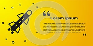 Black Rocket icon isolated on yellow background. Vector