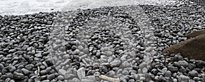 Black Rocks on a Beach