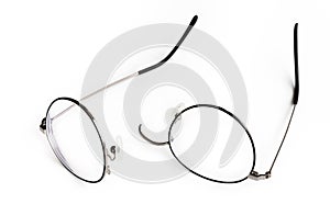 Black round frame eyeglasses have broken. White background