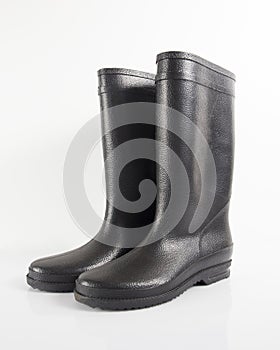 Black rubber boots isolated.