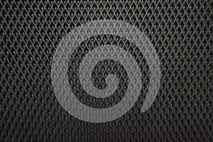 Black rubber car mat as background, top view