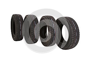 Black rubber car tires isolated on a white background