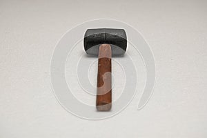 Black rubber mallet on gray surface