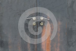 Black rusty iron door with handle