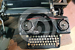 Black rusty typewriter used by typists than once