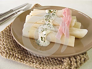 Black salsify roots with mustard sauce and cooked ham