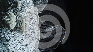 The black sand beach in Iceland. Sea aerial view and top view. A