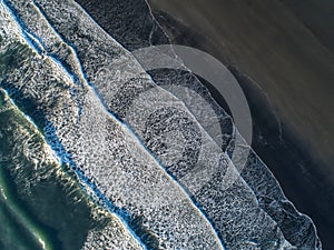 The black sand beach in Iceland. Sea aerial view and top view. A