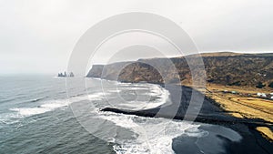 The black sand beach in Iceland. Sea aerial view and top view. Amazing nature, beautiful backgrounds and colors