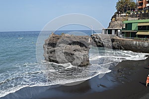 Black Sand Beach With A Large Stone In Its Interior In Puerto Naos In The City Of Los Llanos. Travel, Nature, Landscapes.11 July photo