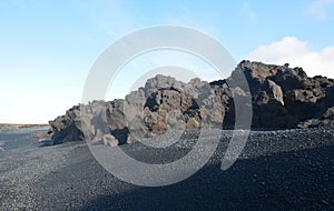 Black Sand Beach and Black Lava Rock Formations