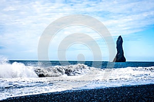 Black sand beach, Reynisfjara shore near the village Vik, atlantic ocean, Iceland