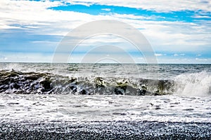 Black sand beach, Reynisfjara shore near the village Vik, atlantic ocean, Iceland