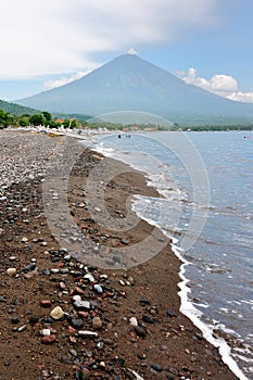 The black sand beach, with the valcano Agung