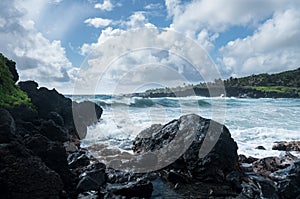 Black sand beach at Waianapanapa on the road to Hana in Maui