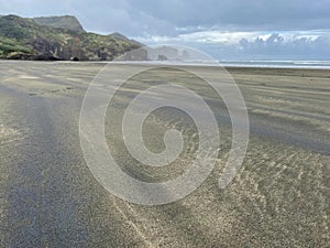 Black sand at Bethells Beach, New Zealand