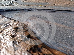 Black sand and coral that became one drifted away by the river current